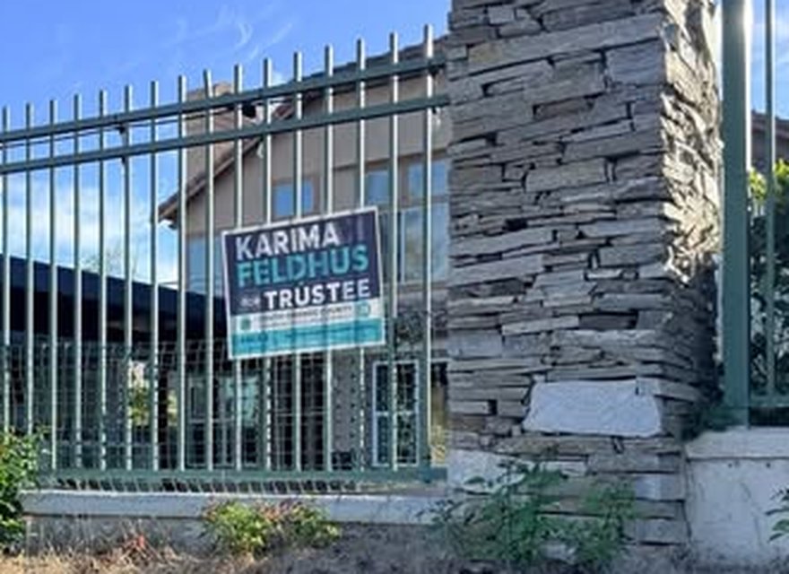 A Karima Feldhus for Trustee yard sign in Area 4